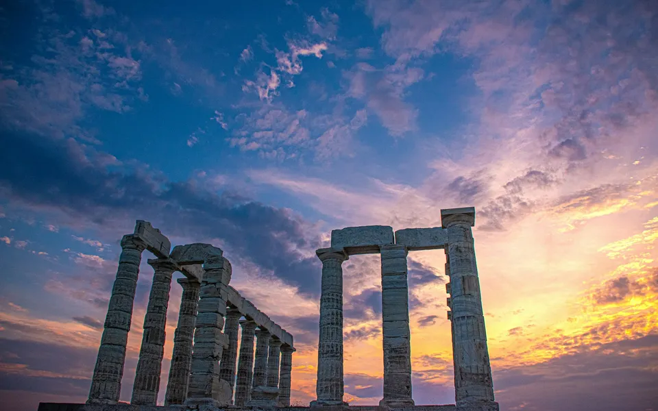 Temple of Poseidon at Cape Sounion during golden hour