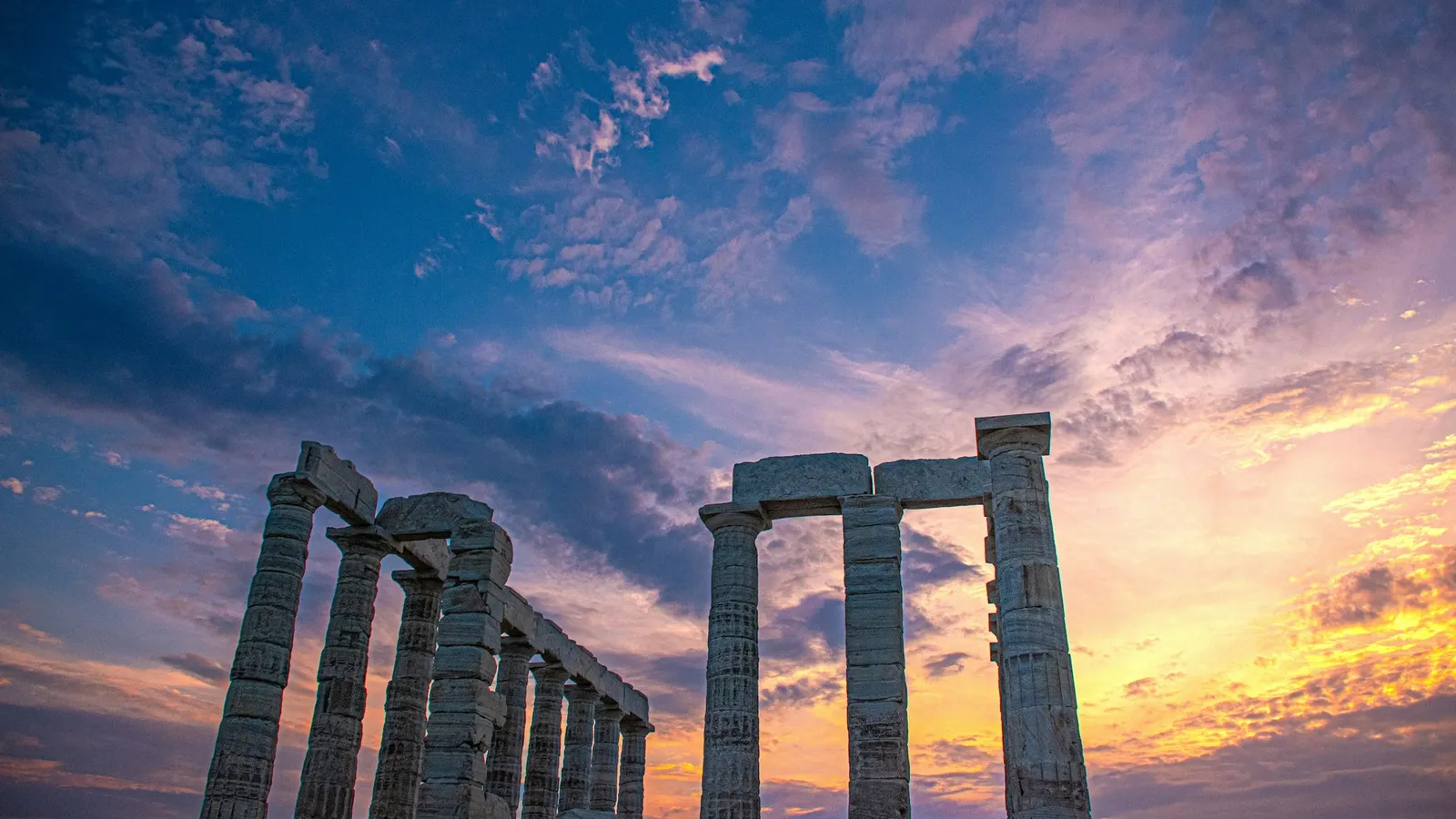 Temple of Poseidon at Cape Sounion during golden hour